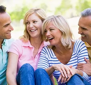 Couple tells another couple about their dental implant dentist near Montgomeryville, PA.